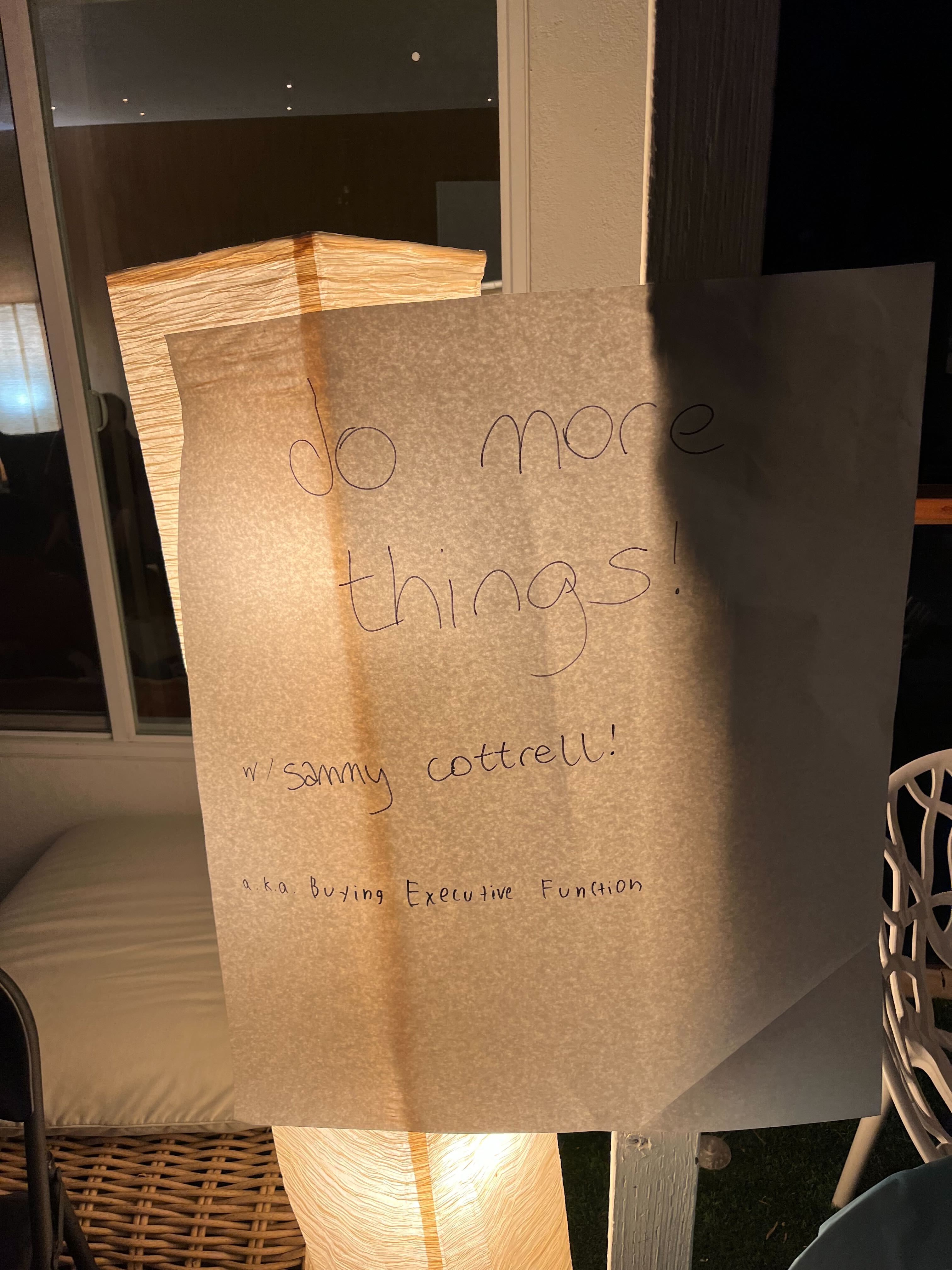 Handmade sign reading 'do more things' at Manifest Night Market